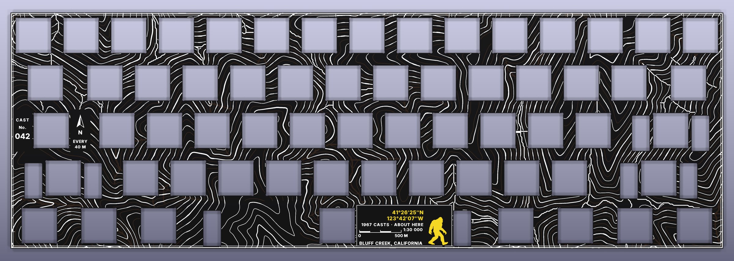 The Trailcast plate from above: contour lines in white across the whole plate, with a coordinates plate and the walking mark